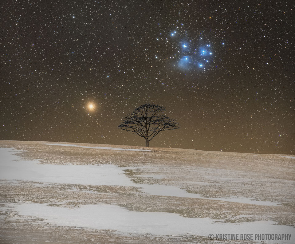 Mars and the Pleiades star cluster set behind one-tree hill. See Explanation.