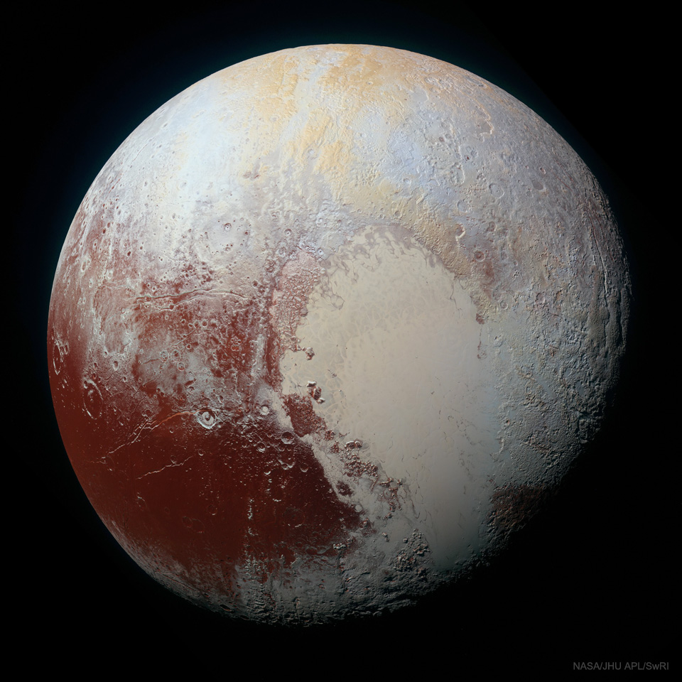 The picture shows Pluto in enhanced colors and high resolution
and seen by the passing New Horizons spacecraft in 2015.
Please see the explanation for more detailed information.