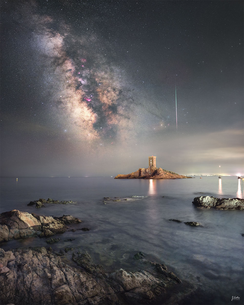 The featured image shows a beach nighscape featuring a bright meteor,
the band of our Milky Way Galaxy, and a small island in the 
Mediterranean Sea of France.
Please see the explanation for more detailed information.