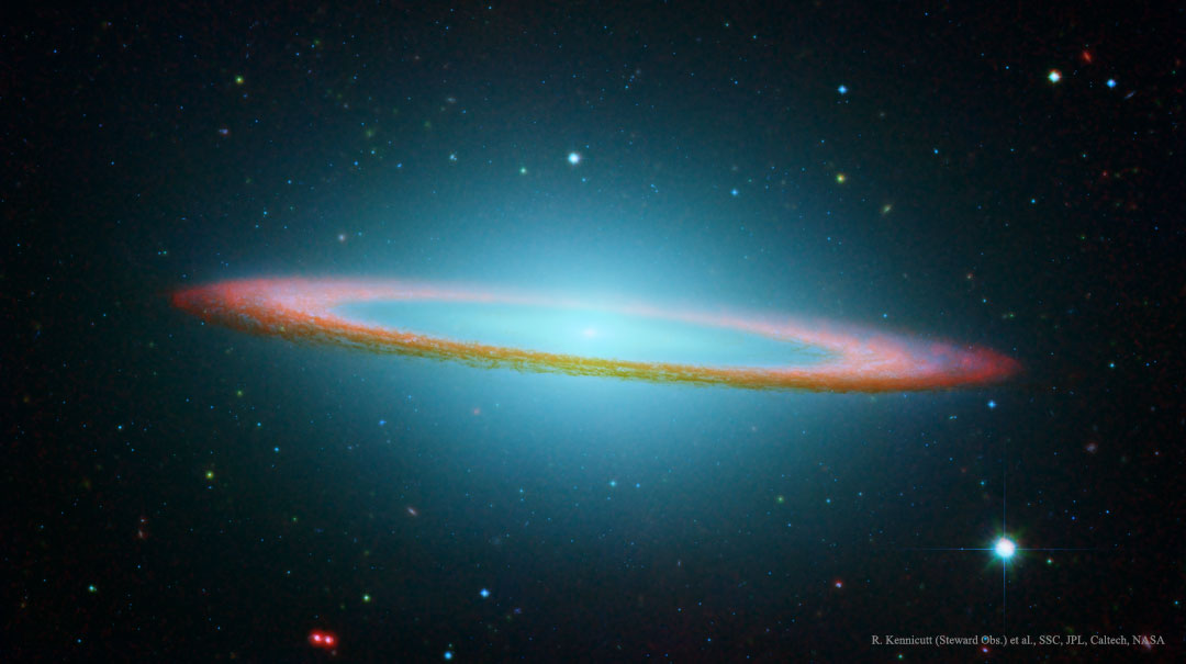 A red-tinged ring of dust is seen nearly on edge. In the ring's
center and extending around the frame, blue gas and stars are shown.
Więcej szczegółowych informacji w opisie poniżej.