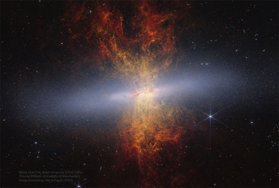 A starfield surrounds an unusual object with 
a band of diffuse white crossing horizontally.
Emanating out from the band toward both the top
and the bottom of the frame is an orange and red
nebula.  
Więcej szczegółowych informacji w opisie poniżej.